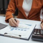 Close,Up,Hands,Of,Woman,In,Brown,Formal,Suit,Checking