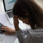 Above,Top,Close,Up,Back,View,Frustrated,Young,Woman,Calculating